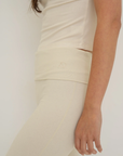 Soft organic cotton fold over leggings in cream with a comfortable fold over waistband.