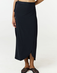 Step into summer with the flowy Soleil Wrap Skirt from AOCO. Featuring a lightweight fabric and an adjustable waist, this piece delivers effortless comfort.