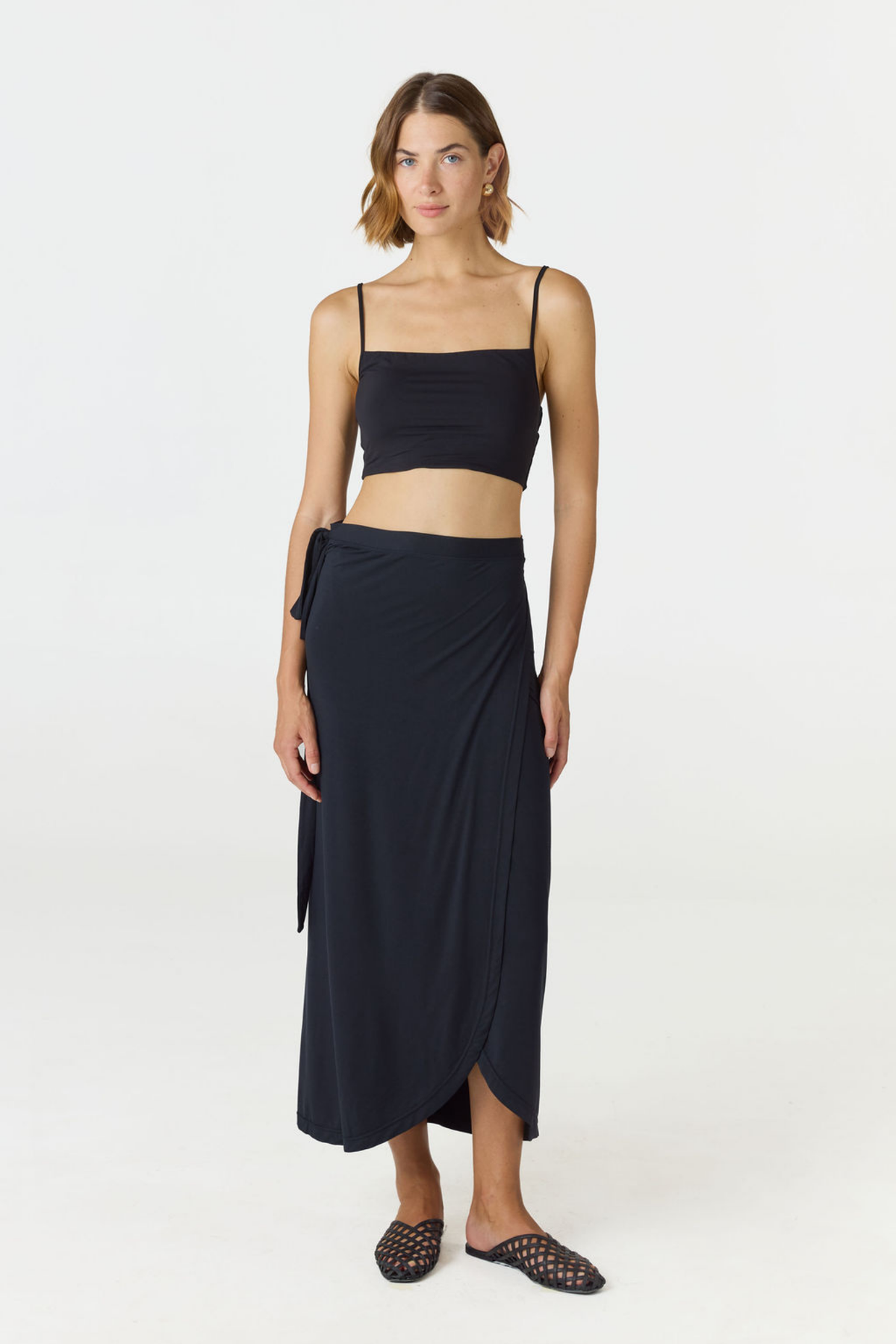 Step into summer with the flowy Soleil Wrap Skirt from AOCO. Featuring a lightweight fabric and an adjustable waist, this piece delivers effortless comfort.