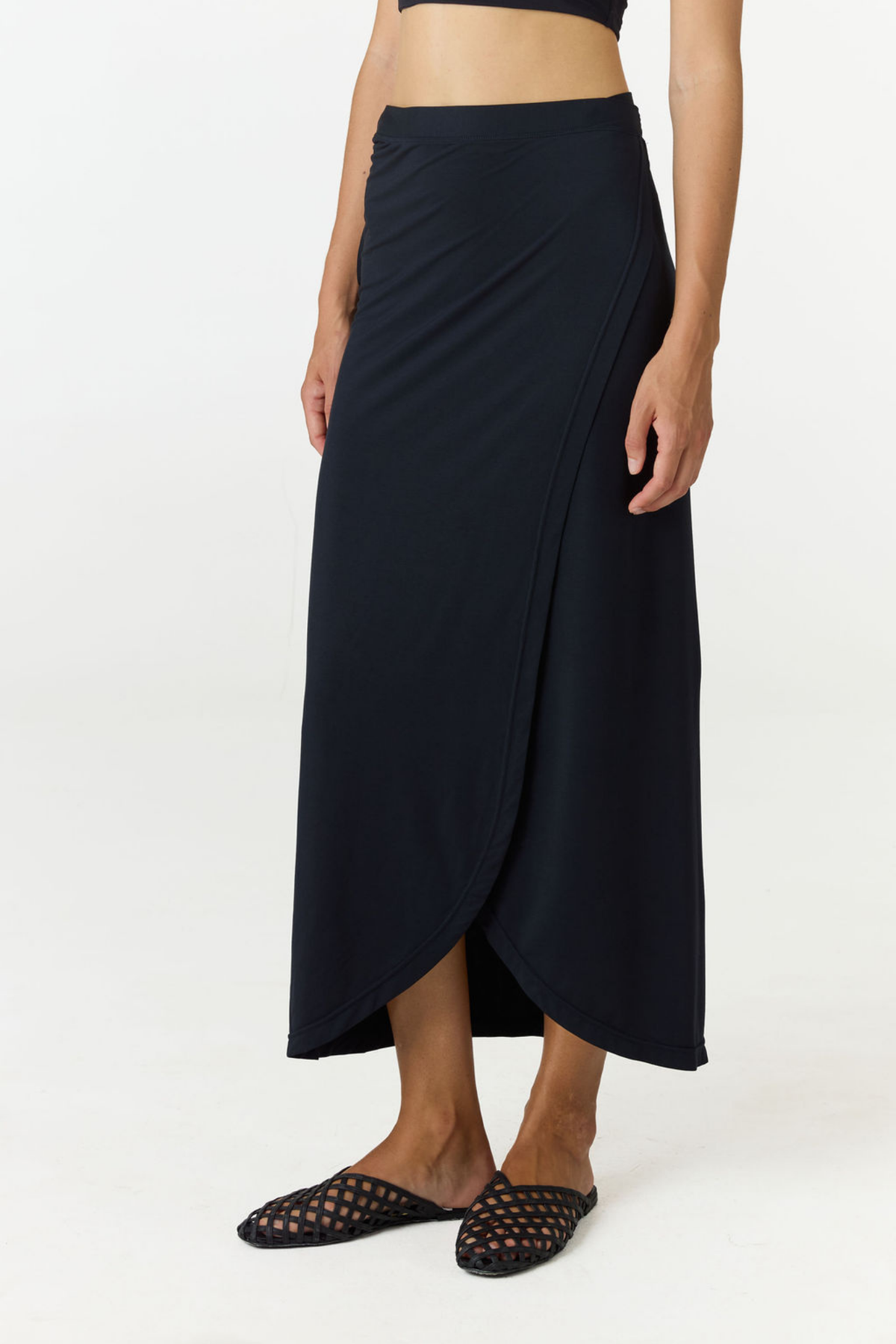 Step into summer with the flowy Soleil Wrap Skirt from AOCO. Featuring a lightweight fabric and an adjustable waist, this piece delivers effortless comfort.