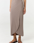 Step into summer with the flowy Soleil Wrap Skirt from AOCO. Featuring a lightweight fabric and an adjustable waist, this piece delivers effortless comfort.