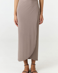 Step into summer with the flowy Soleil Wrap Skirt from AOCO. Featuring a lightweight fabric and an adjustable waist, this piece delivers effortless comfort.