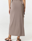 Step into summer with the flowy Soleil Wrap Skirt from AOCO. Featuring a lightweight fabric and an adjustable waist, this piece delivers effortless comfort.