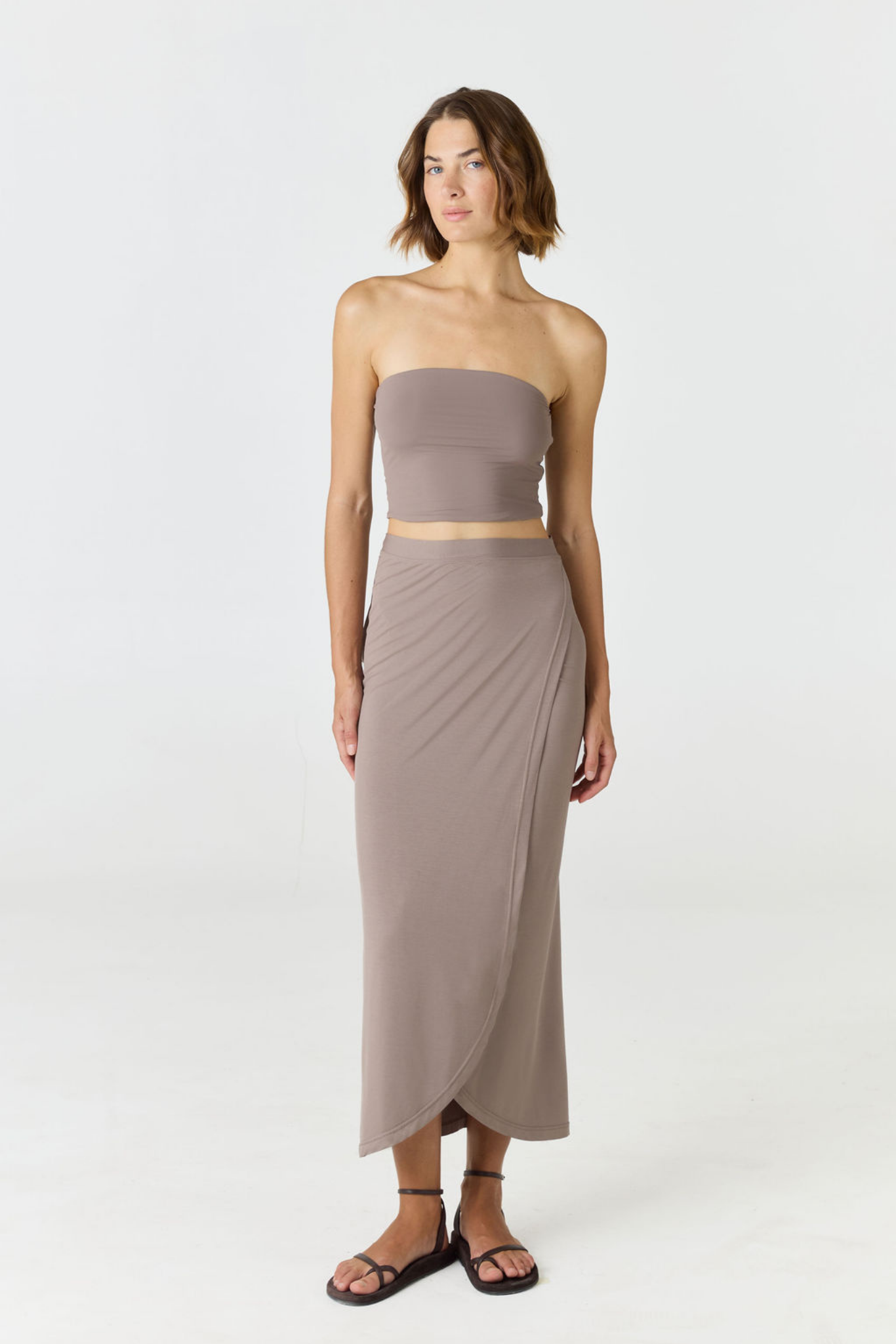 Step into summer with the flowy Soleil Wrap Skirt from AOCO. Featuring a lightweight fabric and an adjustable waist, this piece delivers effortless comfort.