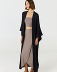 Step into summer with the flowy Soleil Wrap Skirt from AOCO. Featuring a lightweight fabric and an adjustable waist, this piece delivers effortless comfort.