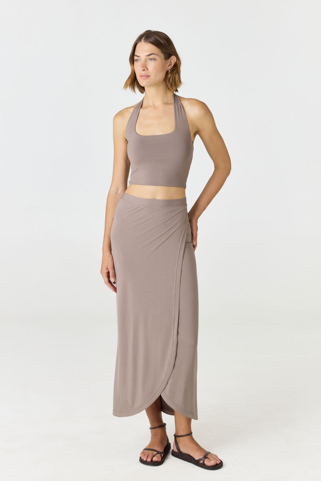 Refresh your summer wardrobe with the Mia Cropped Halter from AOCO. Featuring a chic halter neckline and a flattering cropped fit, it's a warm weather must.